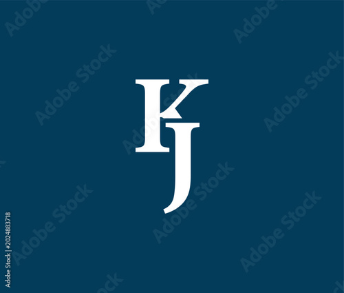 Photos White letter K and J on dark blue background