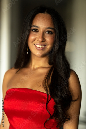 Young brunette woman with a party dress