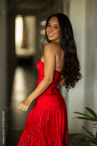 Young brunette woman with a party dress