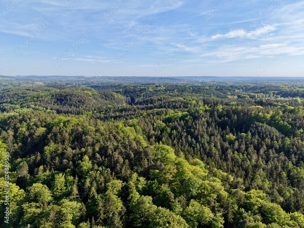Fototapeta premium Scenic countryside with diverse features. Piecedtogether aerial view of rolling terrain and lush greenery