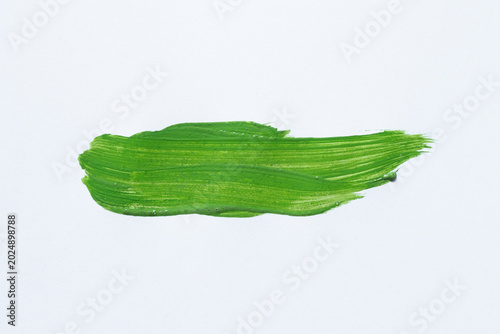 Green brush stroke on a white background for templates, artistic backdrops, textures