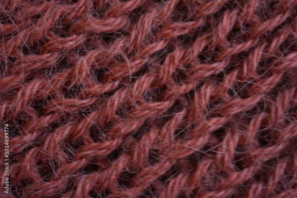 Fototapeta premium Pink knitted fabric texture background, chunky knit wool pattern closeup, cozy textile surface