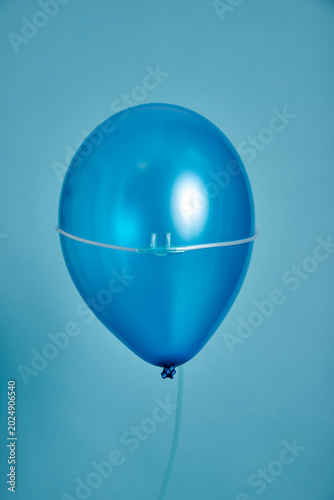 balloon with an oxygen tube over its front, symbolising medical care for children and adults