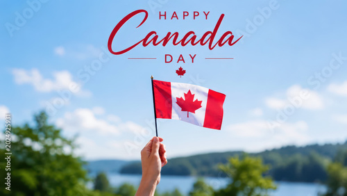 Canada day greeting with hand holding red white flag, maple leaf banner above blue sky, july first national holiday celebration, lakeside summer landscape, patriotic parade picnic festival