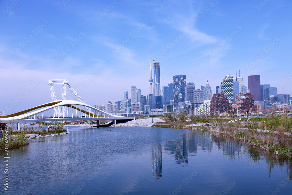 Fototapeta premium Biidaasige Park and the lower Don River with downtown Toronto skyline in the background