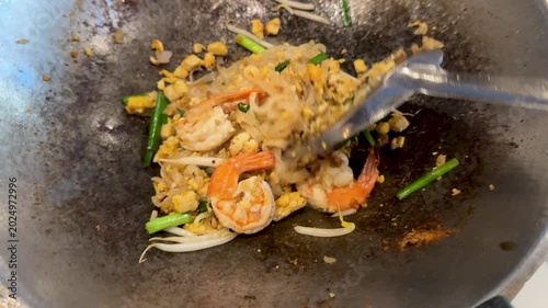 Closeup of Making Pad Thai with Shrimp in a Wok