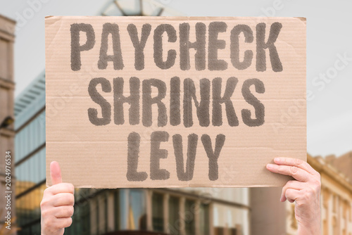 Foto "Paycheck Shrinks Levy" Mandatory levies reduce the practical value of each paycheck before it is spent