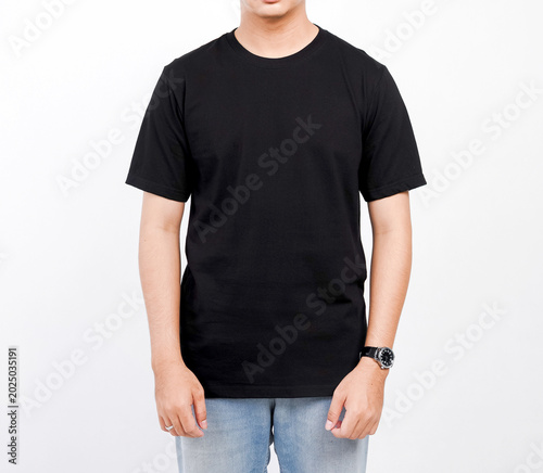 Male body wearing black t-shirt and blue jeans seen from behind and isolated on white background