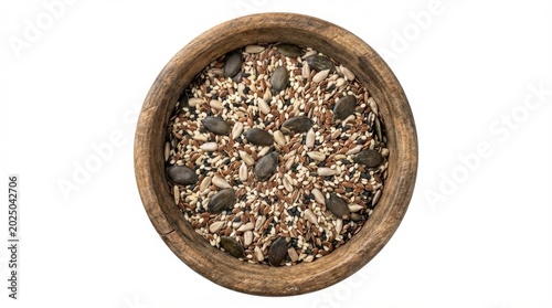 Close-up overhead shot of a wooden bowl filled with a healthy seed mix on white background.