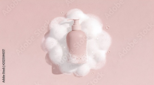 Minimal Pink Pump Bottle Surrounded by White Foam on Pastel Background
