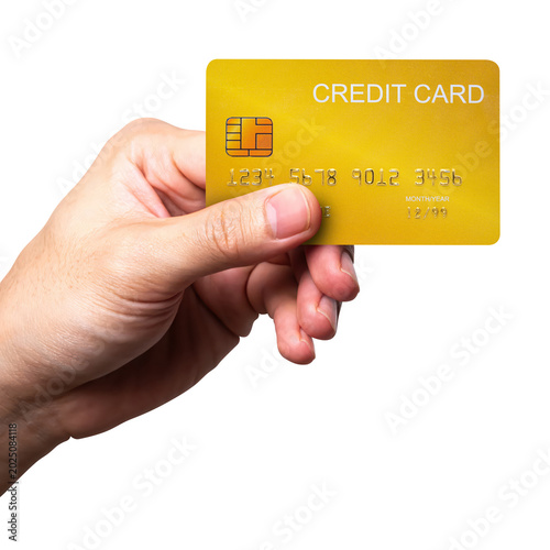 A close-up man hand holds a gold credit card isolated on white background with a clipping path.