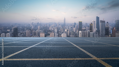 Aerial View of Modern City Skyline from Empty Rooftop