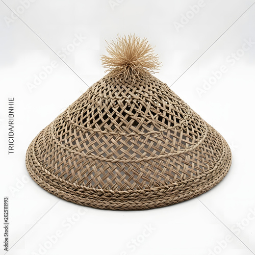 Traditional conical hat made from woven natural straw featuring a decorative fiber tassel topper in this detailed studio product photo