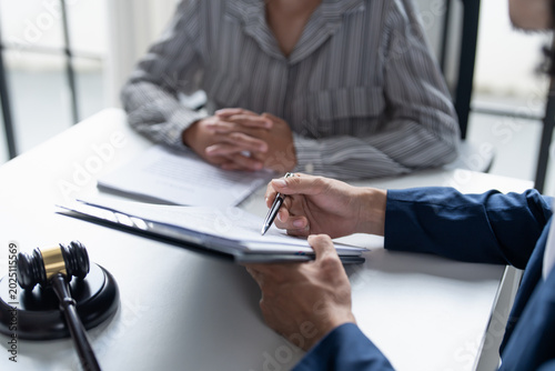 Lawyer businessman working with lawbook in office or courtroom Legal counsel with gavel and legal law. justice and lawyer concept Judge gavel hammer on Lawyer desk.