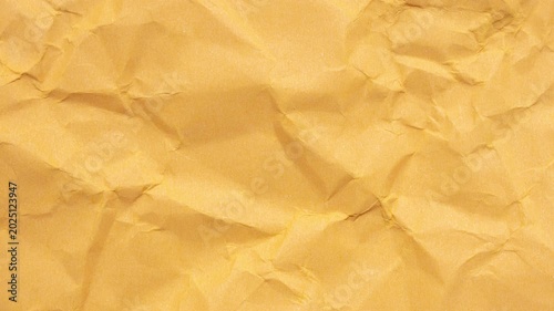 crumpled yellow kraft paper texture background