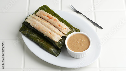 Fotografia Otak-otak Tengiri, made from fish and flour covered with banana leaf