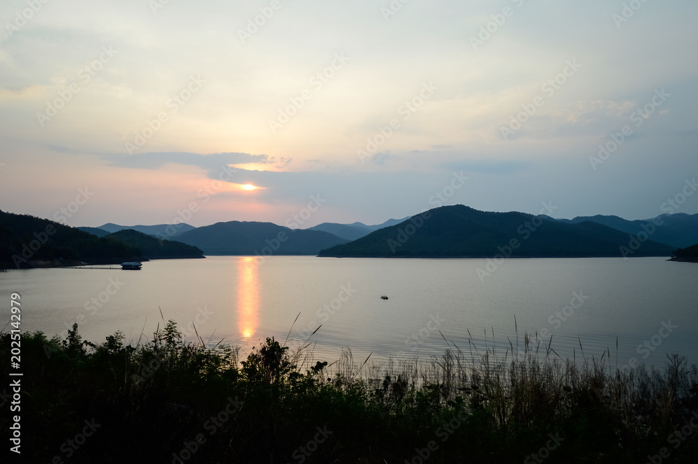 Fototapeta premium Mountain views and a summer sunset at Mae Kuang Udom Thara Dam, Chiang Mai Province, Northern Thailand.