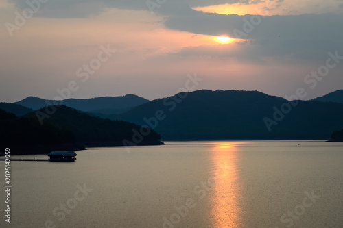 Mountain views and a summer sunset at Mae Kuang Udom Thara Dam, Chiang Mai Province, Northern Thailand.