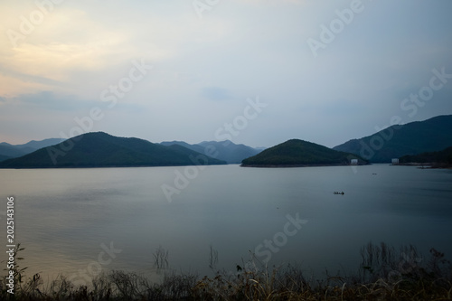 Mountain views and a summer sunset at Mae Kuang Udom Thara Dam, Chiang Mai Province, Northern Thailand.