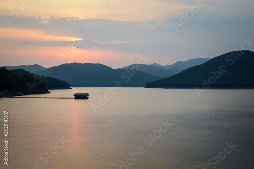 Mountain views and a summer sunset at Mae Kuang Udom Thara Dam, Chiang Mai Province, Northern Thailand.
