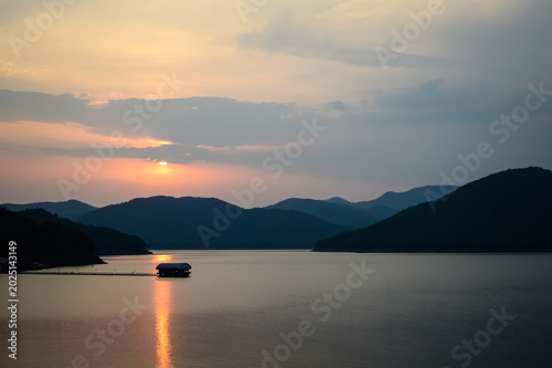 Mountain views and a summer sunset at Mae Kuang Udom Thara Dam, Chiang Mai Province, Northern Thailand.
