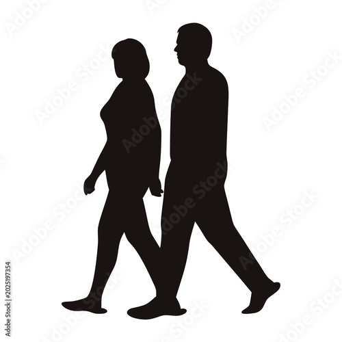 Silhouette of a man and woman walking side by side in black