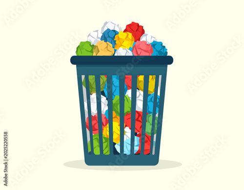 Photos A blue wire mesh wastebasket overflowing with colorful crumpled paper balls