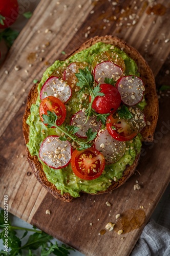 Delicious avocado toast with fresh tomatoes.