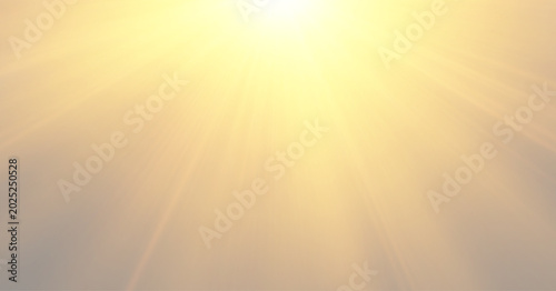 Cinematic anamorphic golden lens flare with soft volumetric glow on dark background