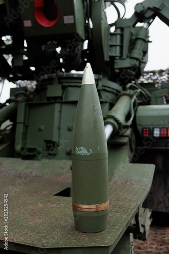 155 mm artillery. 155 caliber shell stands on self-propelled artillery mount