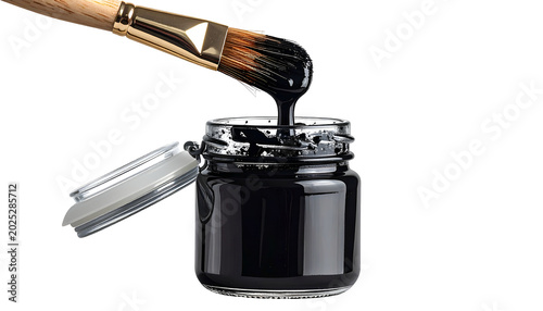 Paintbrush Dipped In Black Ink Jar Studio Lighting Isolated