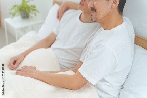 Fotografie Two men cuddling in bed. homosexuality. LGBT.