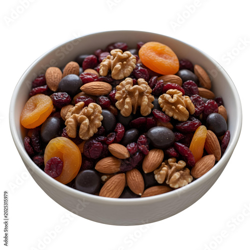 White bowl filled with mixed nuts dried fruit and chocolate candies isolated on a transparent background