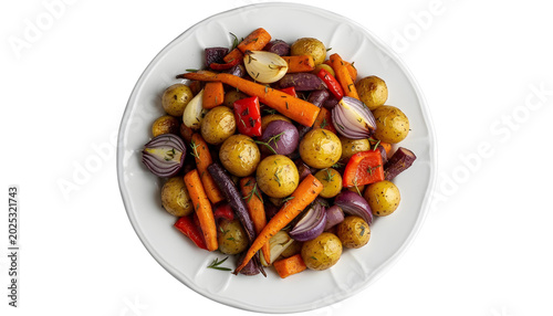 Roasted vegetables including potatoes carrots onions and peppers on platter isolated on a transparent background