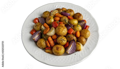 Roasted vegetables including potatoes carrots onions and peppers on platter isolated on a transparent background