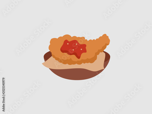 a crispy golden brown fried chicken placed on a traditional plate lined with paper