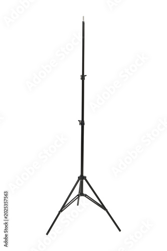 Black metal light stand for photography equipment isolated on transparent background. Adjustable telescopic tripod for studio lighting, softbox, lamp or flash. Professional gear for studio.