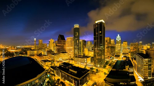 Vibrant Cityscape at Dusk with Illuminated Skyline