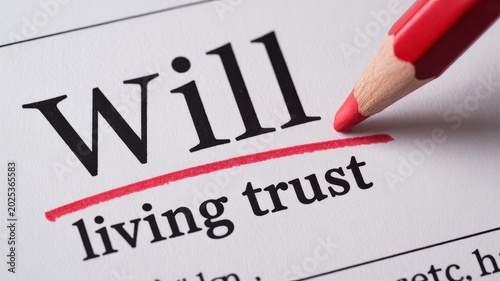 Close-up of the word 'Will' and 'living trust' highlighted on a paper with a red pencil