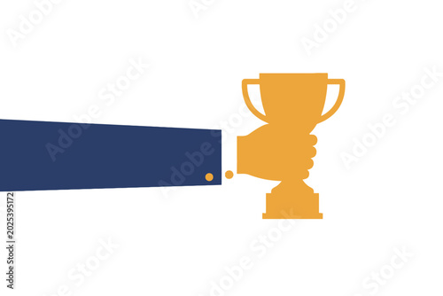 Fotografie Golden trophy cup held by businessman hand