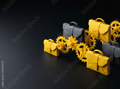 Paper bag ai agent for business with yellow and gray gear chain on black background