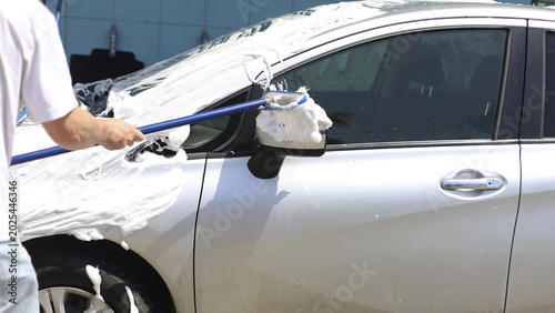 Photos Outdoor car wash scene with foam and suds