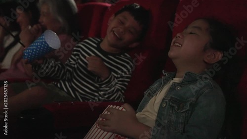 People go to watch movie at cinema complex during weekend. Lifestyle, weekend activity.