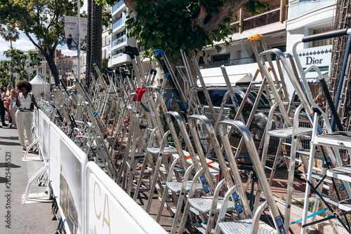 Cannes, France - May 16, 2026: Numerous photographers’ ladders lined up near the red carpet area during the Cannes Film Festival in Cannes, France