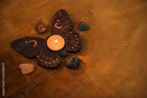 Mystic esoteric concept with Tarot attributes. Candles and crystals