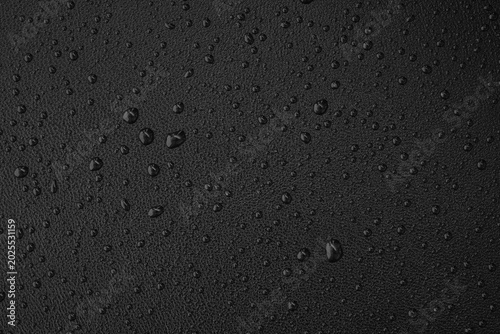 Foto Macro leather texture with water drops, waterproof and hydrophobic surface conce