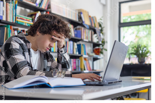 Принти на полотні Teenager struggling with studying and losing focus, boredom and low motivation c