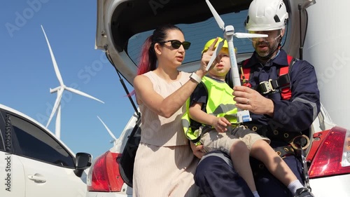 4K Video Wind and Solar Energy Engineer with Family in Wind Turbine Field	