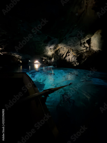 Saint-Léonard, Valais, Switzerland - May 02, 2026: Scenic Boat Tour Gliding Across the Still Turquoise Underground Lake at Lac Souterrain de Saint-Léonard