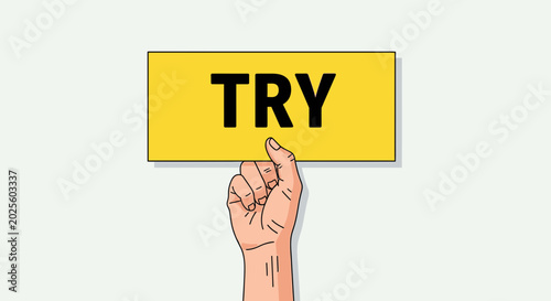 Fotografie Hand holding yellow sign with word TRY, concept of encouragement and motivation